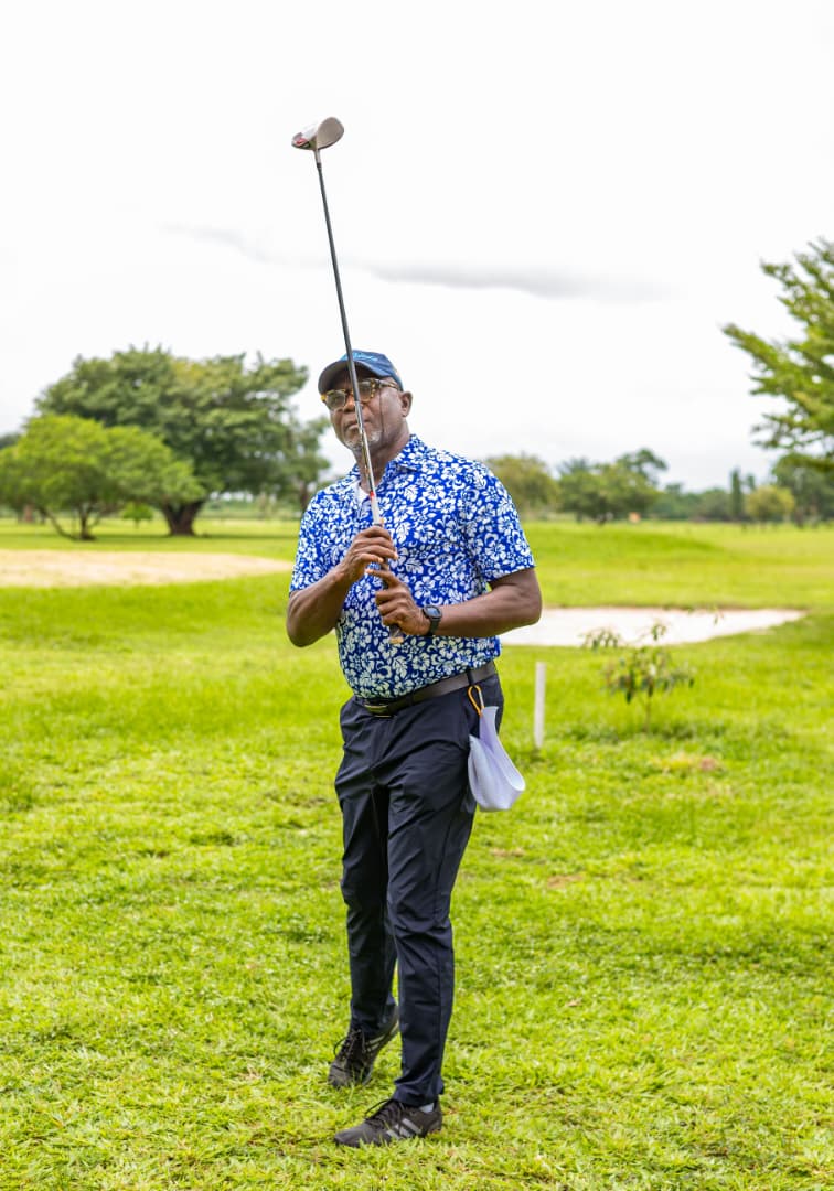 Golfer watching his ball flight down the fairway