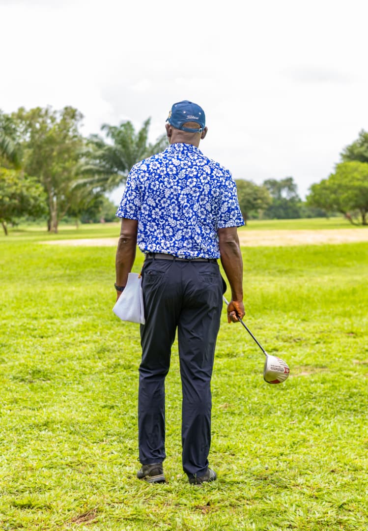 Golfer walking the fairway, driver in hand