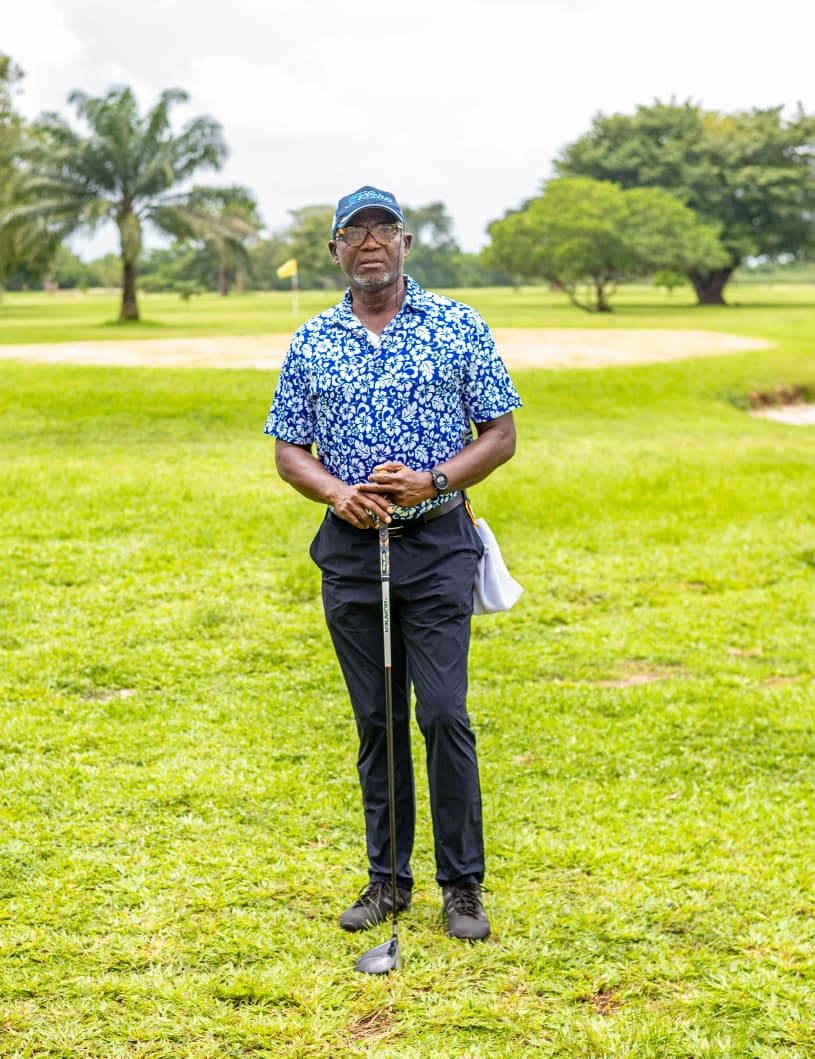 Portrait of a member on the course, club grounded