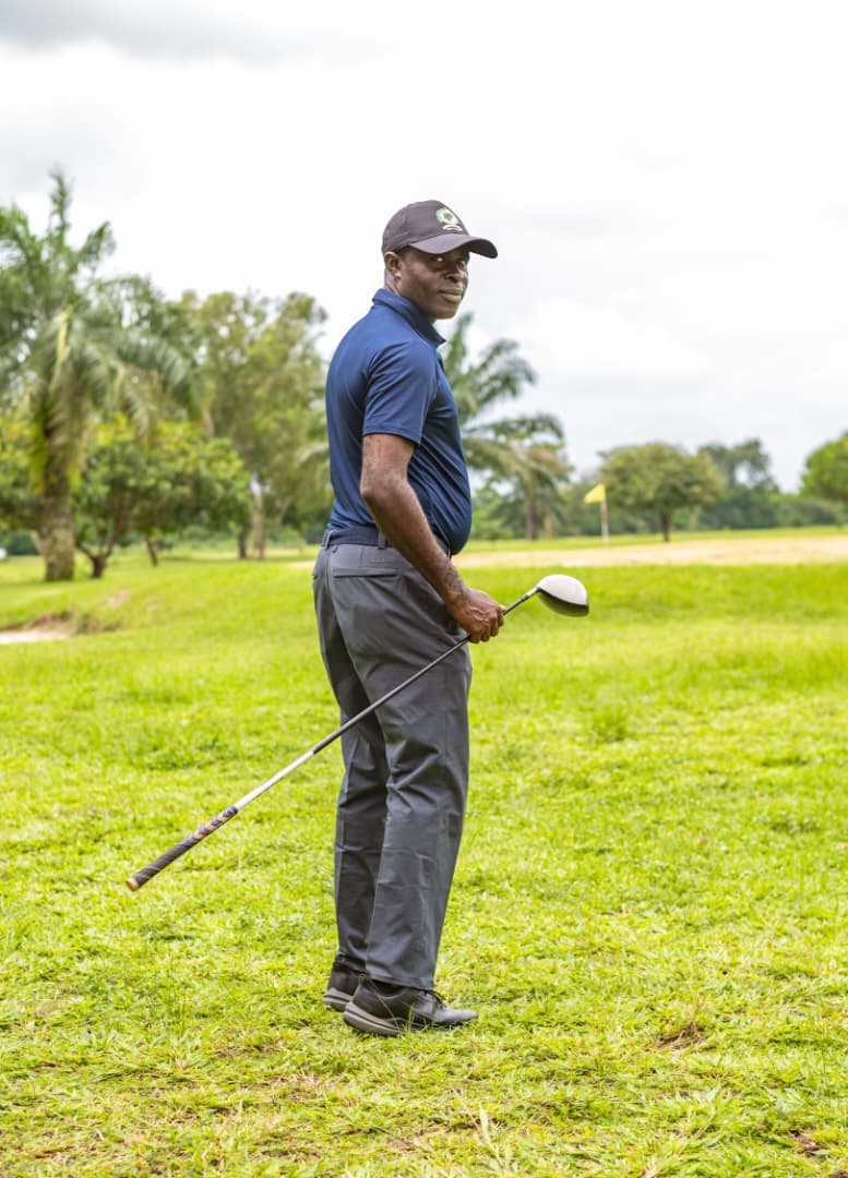 Golfer in navy pausing between shots