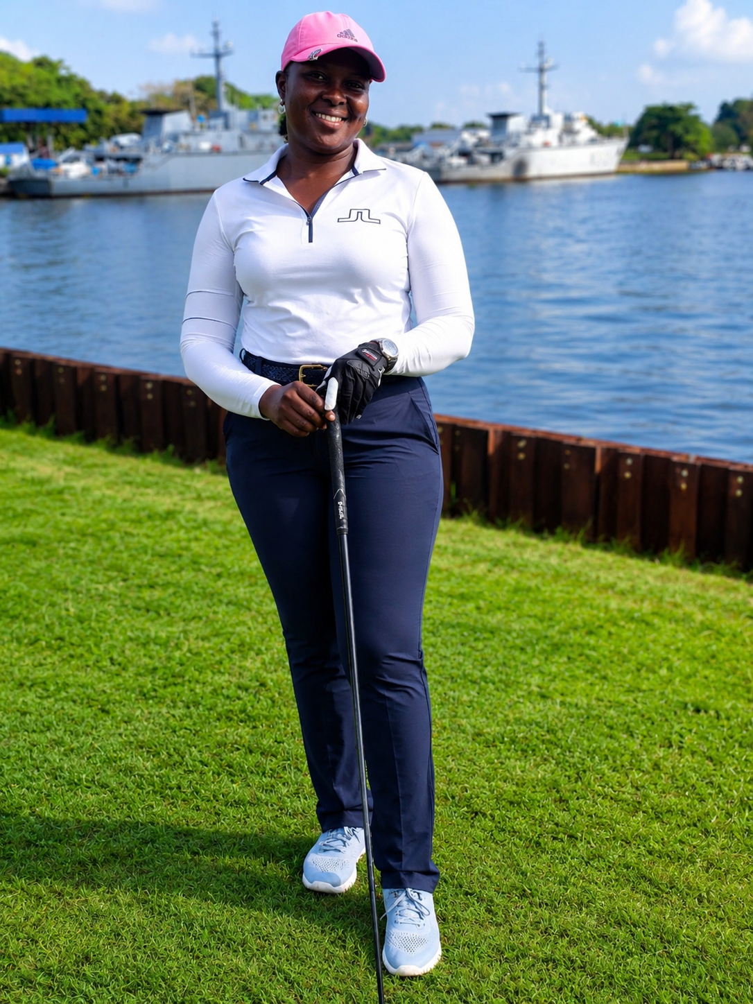 Mrs. Uche Anadebe, Lady Captain of Arsenal Golf & Country Club, with her club